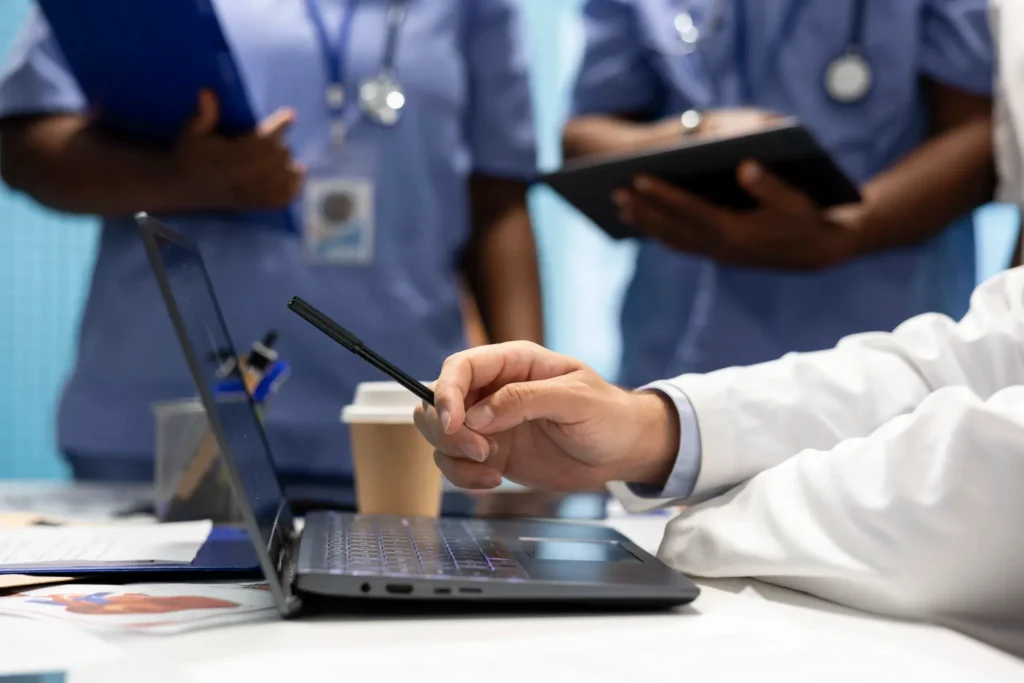 Doctor reviewing billing data to improve financial efficiency in Illinois healthcare