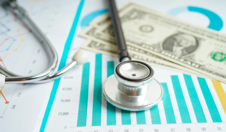 stethoscope-us-dollar-banknotes-chart-graph-paper-financial-account-statistics-business-data-medical-health-concept-1024x683